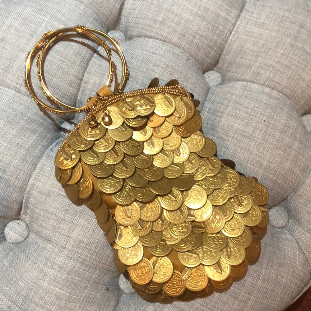 Bracelet Handle purse covered in gold coins.
